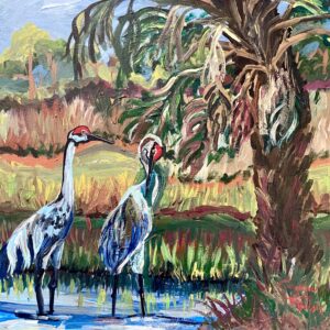Love Birds-Sandhill Cranes is an acrylic painting that depicts two Sandhill Cranes standing in shallow water with a palm tree in the background. The scene features shades of blue, green, and yellow, with a touch of red on the birds' heads and beaks. The sky above the tranquil setting shows some clouds, contributing to the serene atmosphere captured in the artwork.