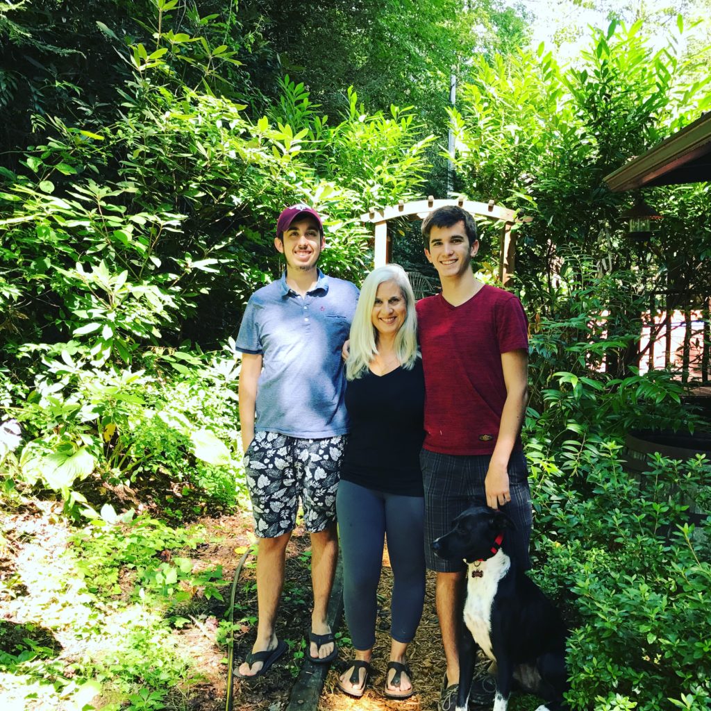 Carolina Karp Artist and her two boys and dog Arya at her North Carolina yoga and painting retreat.