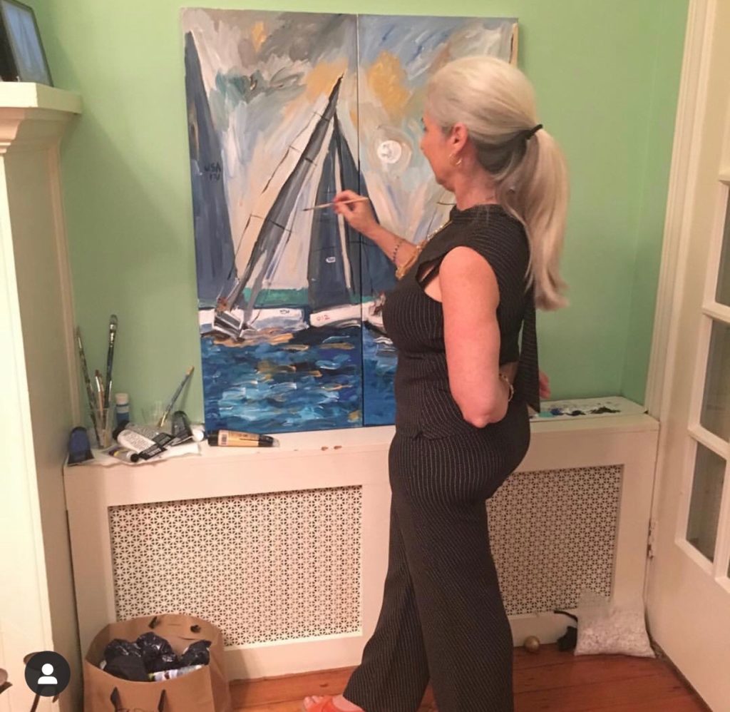 Artist Caroline Karp live painting at her Georgetown show. This two piece painting is of sailboats racing.