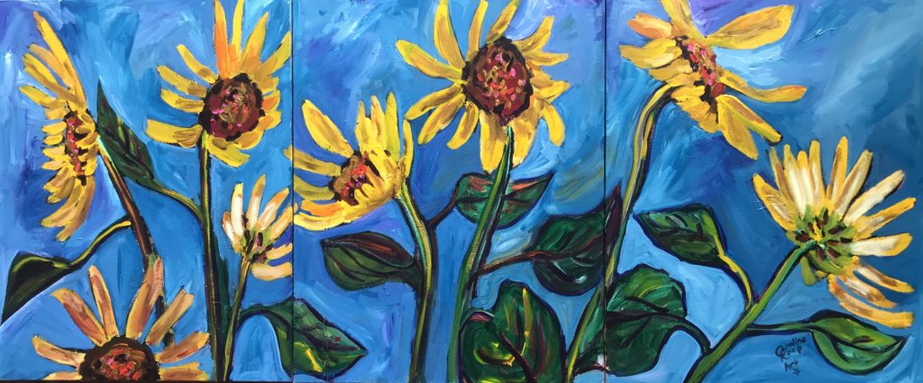Large 3 panel painting of bright yellow sunflowers on a vibrant blue background